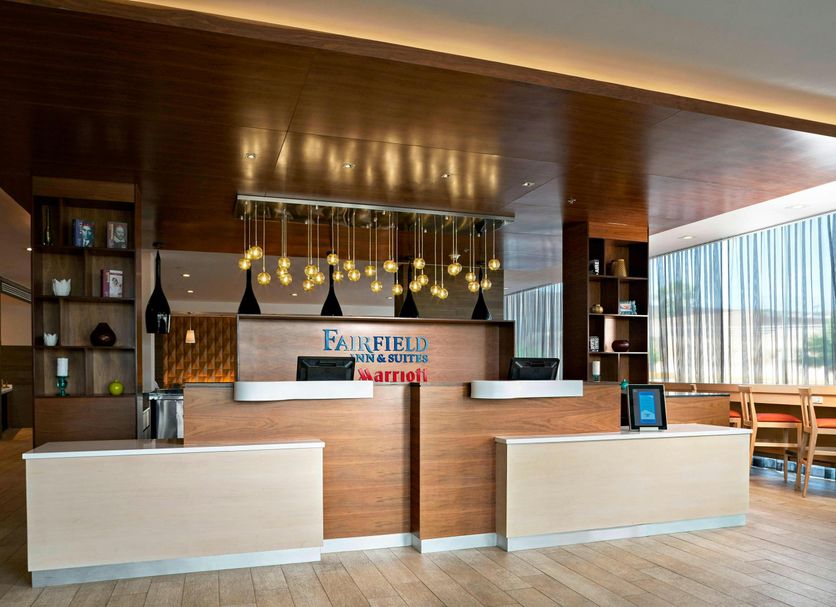 Fairfield Inn & Suites by Marriott Nogales lobby front desk with modern wood accents and seating