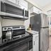 Riverwatch Apartments By Lowkl in Jensen Beach kitchen with stainless steel appliances and dining nook