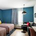 Uptown Suites Extended Stay Denver Co - Centennial guest room with two beds and a seating area