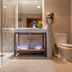 Hotel Plaza Las Matas bathroom with glass shower, vanity, toilet and towel shelf in Las Rozas
