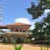 Thirumalai Park in Nilaveli, exterior of a two-story hotel surrounded by trees