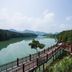 New Century Hotel Guian Guizhou in Anshun with lakeside boardwalk and mountain views