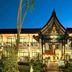 Radateeree Boutique Resort in Chiang Mai at night, showing a lit Thai-style entrance and garden