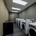 Four Points by Sheraton Brunswick laundry room with rows of washing machines and dryers