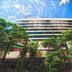 Rachaphruk Grand Hotel in Nakhon Ratchasima, exterior view of a modern multi-story hotel with trees