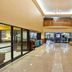 Holiday Inn Express & Suites Canton lobby with seating area, front desk, and mezzanine view