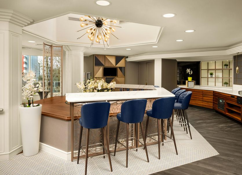 DoubleTree by Hilton Hotel Luxembourg bar area with blue stools and marble counter in Luxembourg