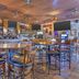 Best Western Gold Canyon Inn & Suites bar and dining area with tables, stools, and TV screens