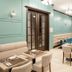 Concorde Old Bucharest Hotel in Bucharest: elegant restaurant with teal walls, booths, tables and chairs