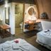 Hotel Vai Moana in Hanga Roa spa treatment room with massage beds, bench and vanity sink