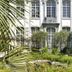 B&B The Verhaegen in Ghent: elegant hotel facade with manicured garden and tall arched windows