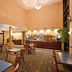 Holiday Inn Express & Suites Cleveland-Richfield lobby with seating area and breakfast bar in Richfield