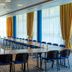 Crowne Plaza Vilnius meeting room in Vilnius with long conference table and blue chairs