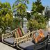 Onomo Hotel Rabat Terminus rooftop terrace with wicker lounge chairs and potted tropical plants in Rabat