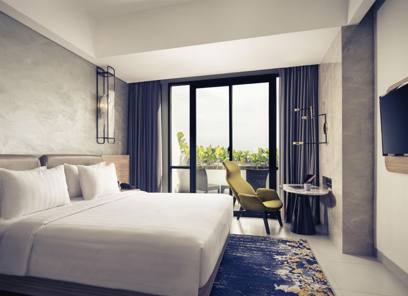 Mercure Bandung City Centre room with king bed and balcony city view in Bandung