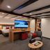Gasthaus Staude in Triberg lounge with sofa, armchair, coffee table and wall-mounted TV