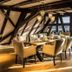 Hotel Hofgut Hohenkarpfen dining room in Hausen ob Verena with a long table and upholstered chairs