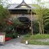 Kurhaus Ishibashi Ryokan in Shimoda, traditional ryokan entrance surrounded by bamboo and greenery