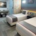 Illusion Xpress I Attraction Hotel Deluxe room in Playa del Carmen with two beds and walk-in shower