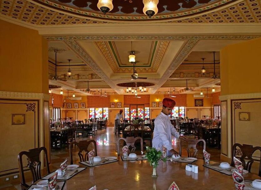 Welcomhotel By ITC Hotels, Fort & Dunes, Khimsar dining room with ornate ceiling and set tables