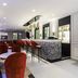ibis Styles Toulouse Centre Capitole bar lounge with red velvet chairs and mosaic bar in Toulouse
