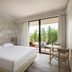 Una Hotels Forte Dei Marmi guest room with king bed and balcony view in Forte dei Marmi