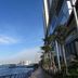 Hotel Glodok Plaza in Jakarta with waterfront views beside a modern high-rise building