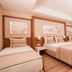 Venosa Beach Resort And Spa in Didim: bright guest room with one double bed, twin bed and balcony view