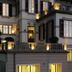 Casa Brenna Tosatto Art Experience in Lenno, illuminated hotel facade with balconies and shuttered windows