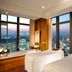 Mandarin Oriental, Tokyo spa treatment room with skyline views over Tokyo at dusk