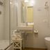 B&B Quattro Cantoni bathroom in Siena with shower, vanity sink, wall-mounted toilet and towels