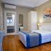 Triada Hotel Taksim in Istanbul, guest room with king bed, nightstands, wardrobe and bathroom doorway