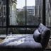 Chiang Mai Thai House guest room with chaise lounge and floor-to-ceiling city view in Chiang Mai