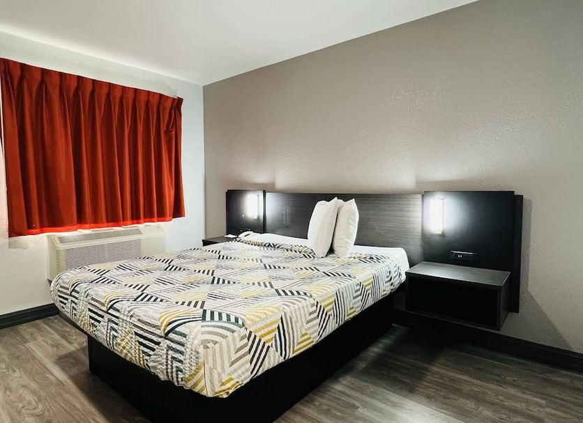 Motel 6-La Mesa, Ca - San Diego guest room with double bed and red curtains in La Mesa