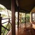Lake Elmenteita Serena Camp veranda with sofa, table and lake view in Nakuru