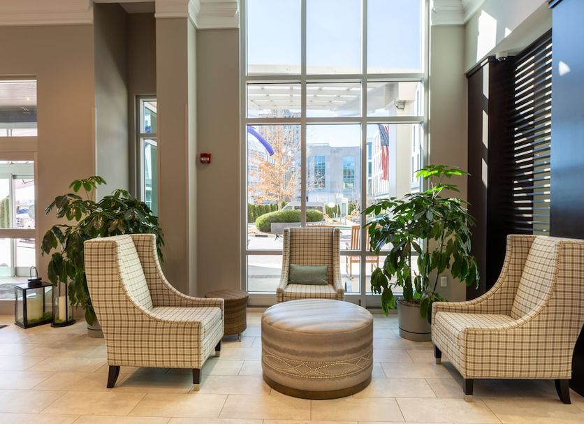 Hilton Garden Inn Asheville Downtown lobby seating area with large windows and city view