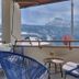 Seehotel Riviera at Lake Lucerne in Gersau balcony with chairs and panoramic lake and mountain view
