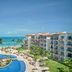 Fiesta Americana Cancun Villas in Cancún with oceanfront pool, palm trees, and beach view