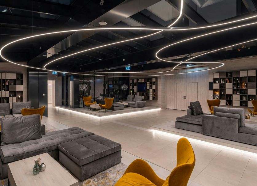 Hotel Vision Budapest by Continental Group lobby with modern seating and curved ceiling lights in Budapest
