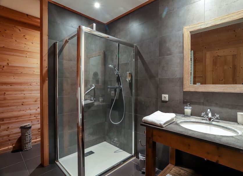 Pêche De Vigne & Spa in Rodern bathroom with glass shower and stone sink vanity