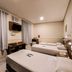 Hotel Itamarati Centro-República in Sao Paulo: twin beds, desk, wall-mounted TV, and curtained window