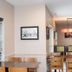 Country Inn & Suites by Radisson, Lehighton,PA dining area with tables, chairs, and large window blinds