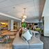 Home2 Suites by Hilton Tampa - USF/Near Busch Gardens lobby with seating area and dining tables