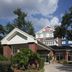 Hilton Garden Inn Tampa-East/Brandon in Tampa exterior with brick facade, entrance canopy, and trees
