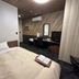 Grand Park Hotel Odate guest room with bed, desk, TV, and air conditioner in Ōdate