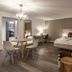 Karma Bavaria, Schliersee: spacious suite with king bed, dining table, desk and seating area