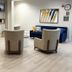 Comfort Inn & Suites Virginia Beach - Norfolk Airport lobby seating area with staircase and wall art