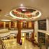 Gold River Side Hotel Jiaxing lobby with circular ceiling design, mezzanine, and glass walls