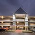 MainStay Suites Knoxville - Cedar Bluff in Farragut at dusk, exterior with covered entrance and parked cars