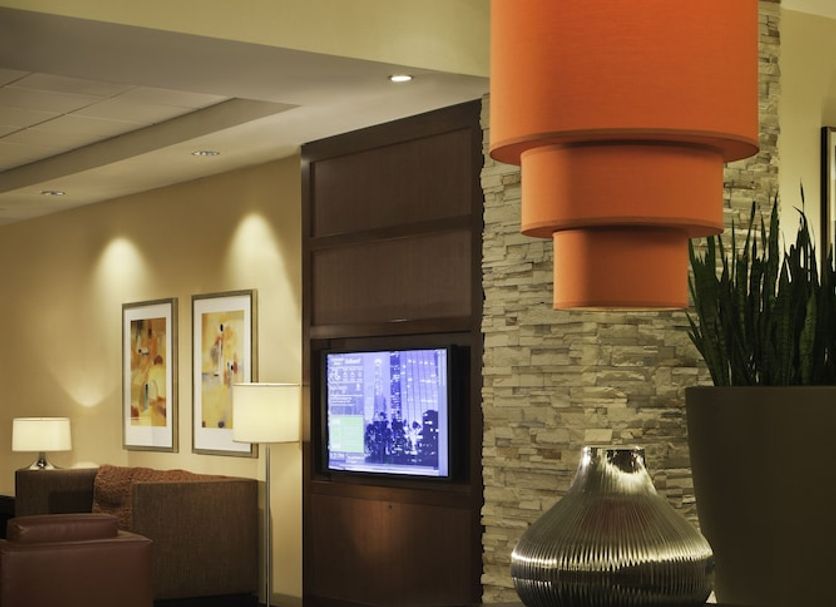 Courtyard by Marriott Los Angeles Sherman Oaks lobby with orange pendant light and seating area